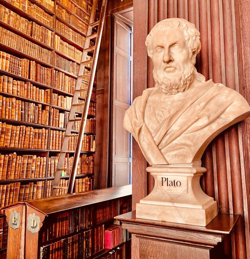 a statue of a person in a library