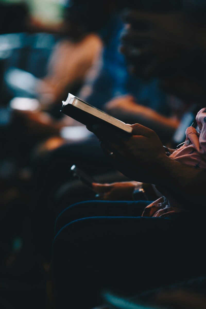 a person holding a book in their hands